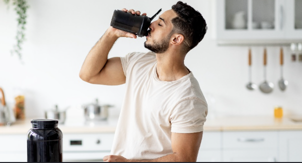 Man drinking a nutritional supplement